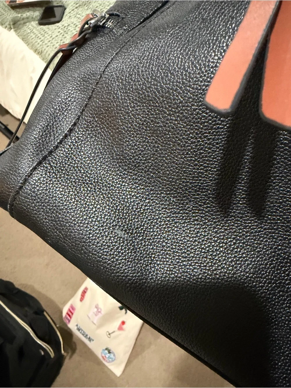 Sleek Black Leather Shoulder Bag with Brown Strap